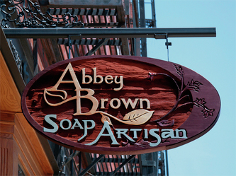 Image of the wood blade sign for Abbey Brown Soap in Old Town Chicago, IL